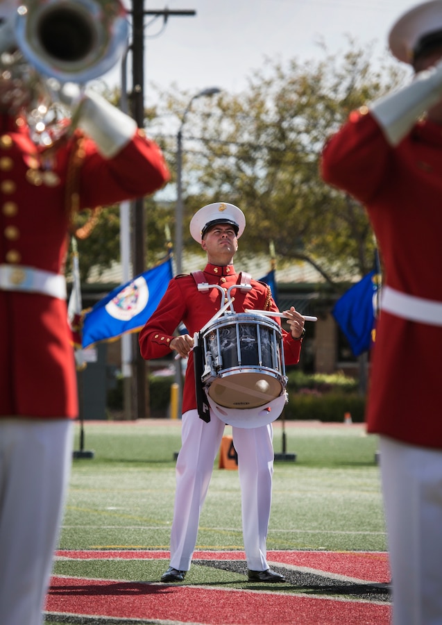 U.S. Marines with “The Commandant’s Own”, The United States Marine Drum & Bugle Corps, Battle Color Detachment, Marine Barracks Washington, D.C., performs in front of Marine Corps Air Station Miramar’s leaders, family and friends during the 2019 Battle Color Ceremony at MCAS Miramar, Calif., Mar. 15. The ceremony is held to honor Marine Corps traditions through performances by  “The Commandant’s Own”, the Silent Drill Platoon and the Battle Colors Detachment as a whole. (U.S. Marine Corps photo by Cpl. Becky Cleveland)