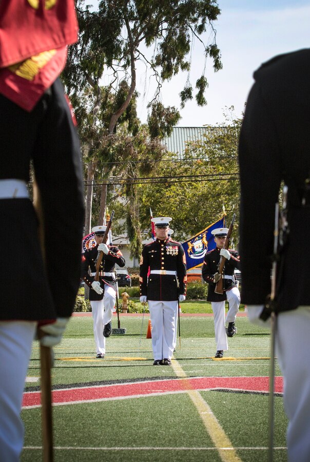 The U.S. Marine Corps Silent Drill Platoon, Battle Color Detachment, Marine Barracks Washington, D.C., performs in front of Marine Corps Air Station Miramar’s leaders, family and friends during the 2019 Battle Color Ceremony at MCAS Miramar, Calif., Mar. 15. The ceremony is held to honor Marine Corps traditions through performances by  “The Commandants Own”, the Silent Drill Platoon and the Battle Colors Detachment as a whole. (U.S. Marine Corps photo by Cpl. Becky Cleveland)