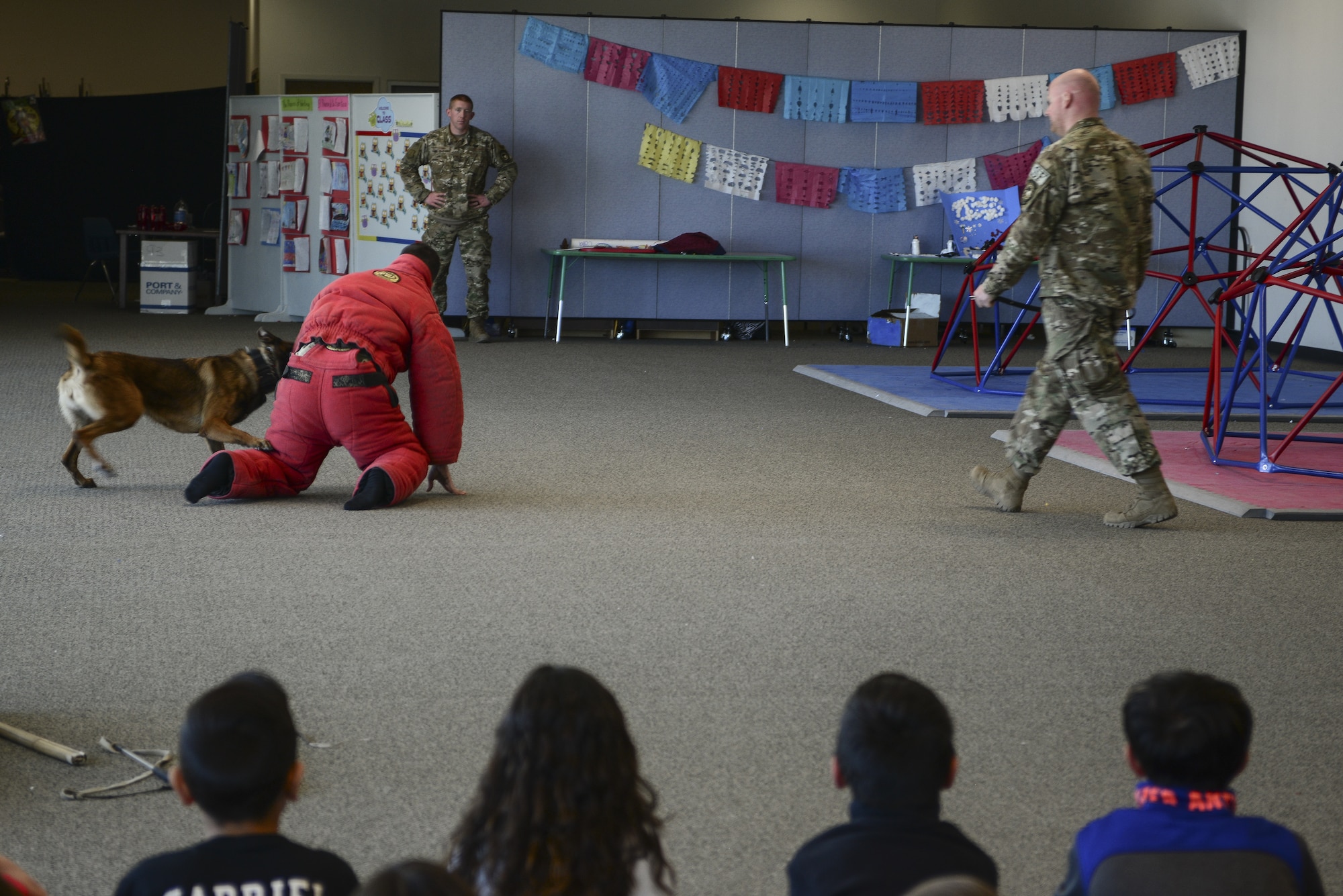 Members of the 377th Security Forces Squadron Military Working Dog section perform a demonstration in Rio Rancho, N.M., March 15, 2019. In addition to a demonstration, the team took time for a question-and-answer session. (U.S. Air Force photo by Staff Sgt. Kimberly Nagle)