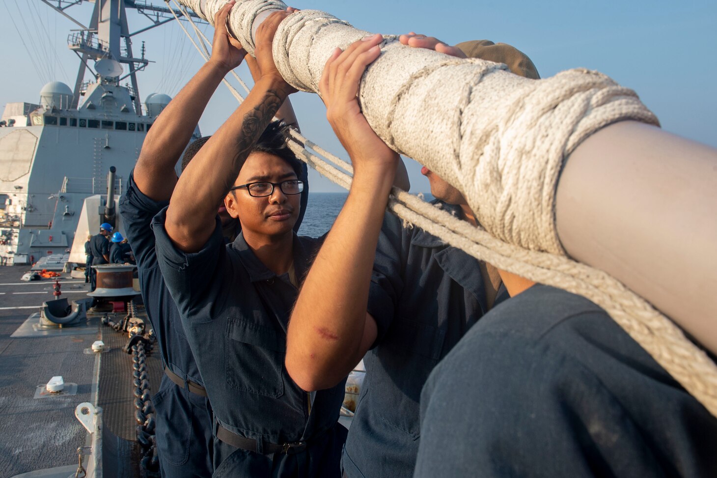Phuket, Thailand (March 18, 2019) Sailors install the jack staff during sea and anchor detail aboard the Arleigh Burke-class guided-missile destroyer USS Preble (DDG 88) off the coast of Phuket, Thailand. Preble is visiting Phuket for a regular scheduled port visit. Preble is deployed to the U.S 7th Fleet area of operations in support of security and stability in the Indo-Pacific region.