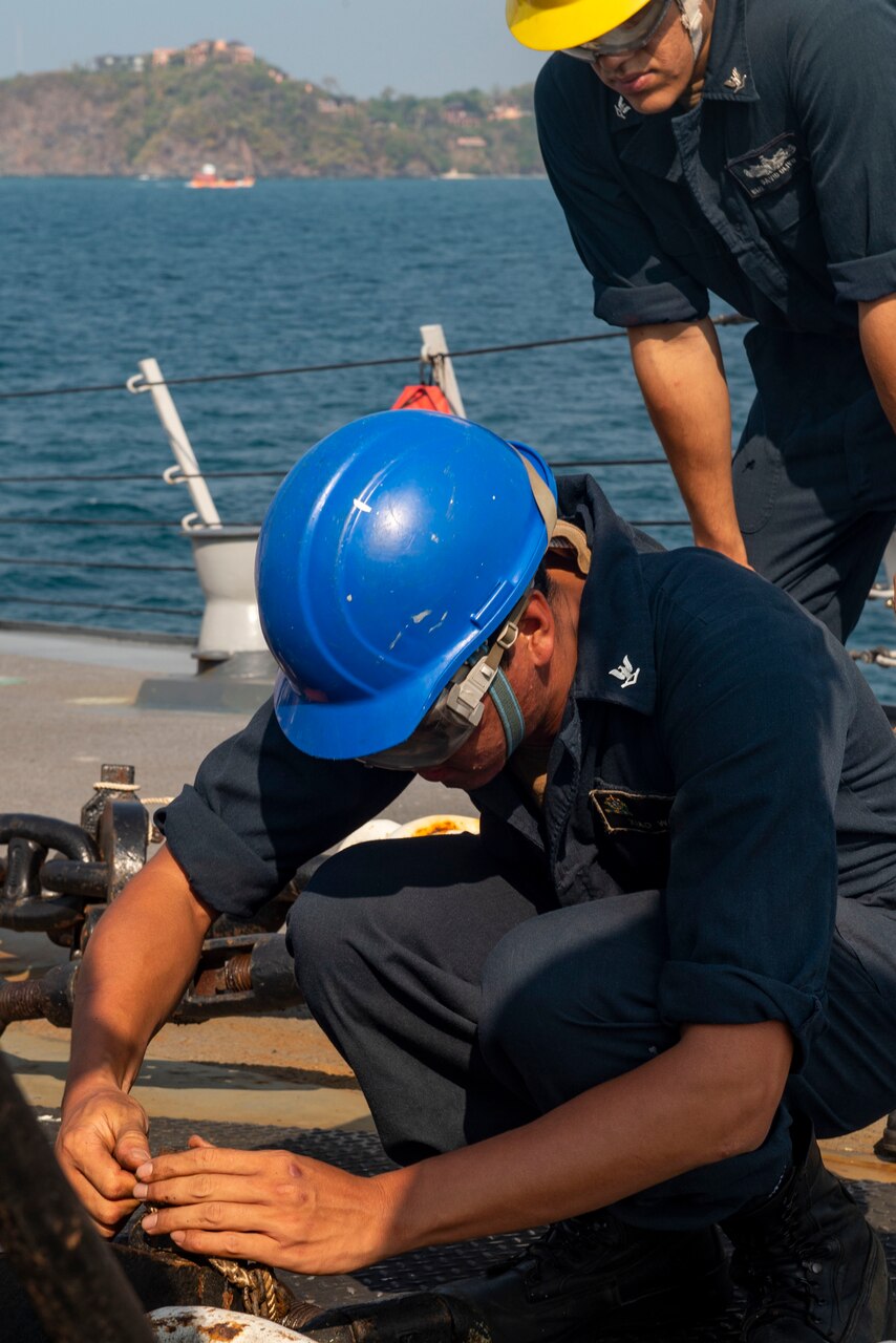 Phuket, Thailand (March 18, 2019) Boatswain’s Mate 3rd Class Xiao Wang, from San Francisco, secures the bail of a pelican hook as Boatswain’s Mate 3rd Class David Olivo, from Lawton, Okla., supervises during sea and anchor detail aboard the Arleigh Burke-class guided-missile destroyer USS Preble (DDG 88) off the coast of Phuket, Thailand. Preble is visiting Phuket for a regular scheduled port visit. Preble is deployed to the U.S 7th Fleet area of operations in support of security and stability in the Indo-Pacific region.