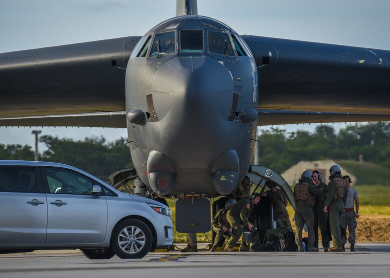 Aircrew from the 23rd Expeditionary Bomb Squadron change places on the B-52 Stratofortress with a pre-flight crew at Andersen Air Force Base, Guam, March 18, 2019.