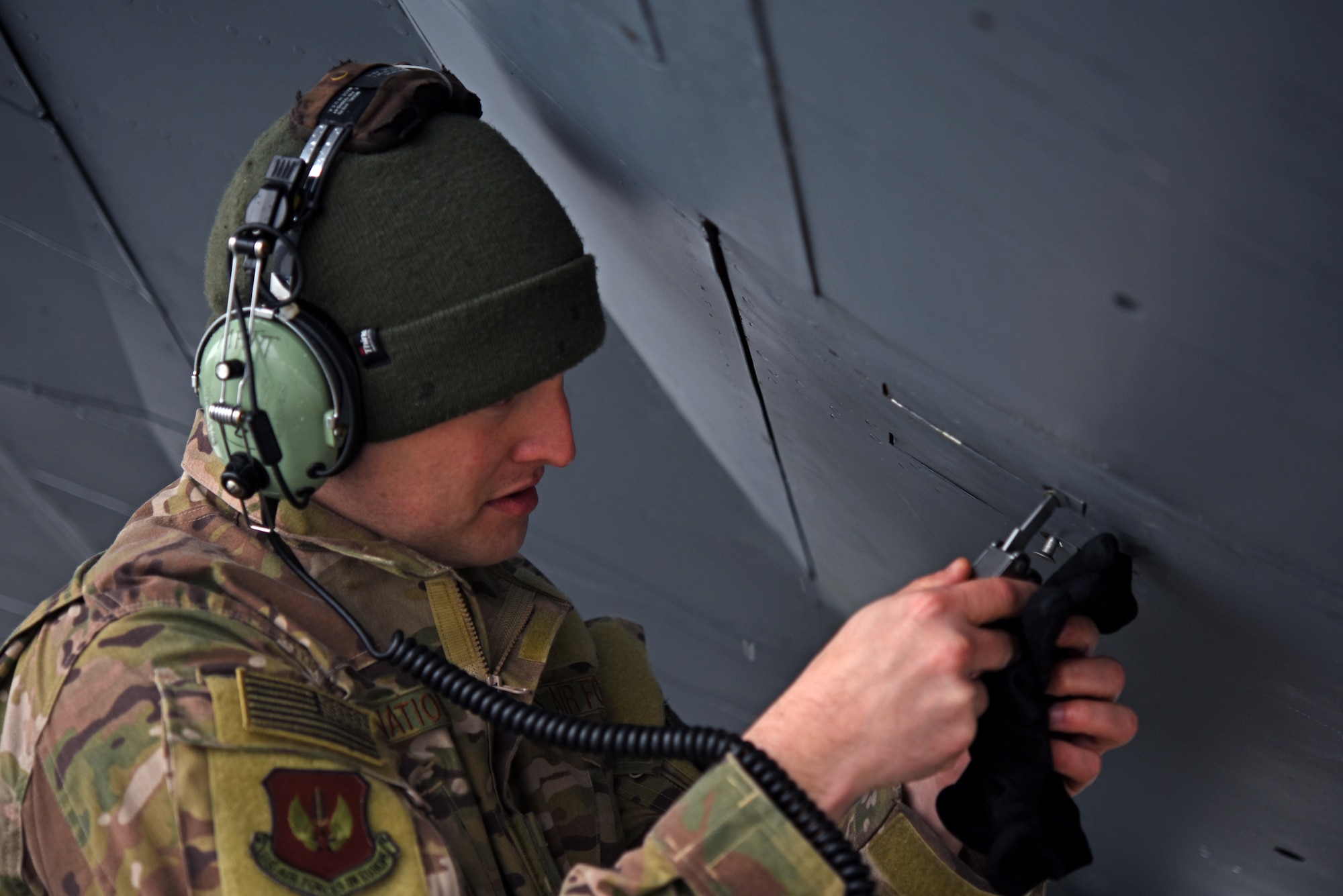 U.S. Air Force Staff Sgt. Shannon Nations, 100th Aircraft Maintenance Squadron flying crew chief, preps a KC-135 Stratotanker from RAF Mildenhall prior to take-off for refueling training with Romanian air force F-16s in Bucharest, Romania, March 12, 2019. The training was an example of U.S. and NATO allies sharing a commitment to promote peace and stability through developing their relationship and communication process. (U.S. Air Force photo by Airman 1st Class Brandon Esau)