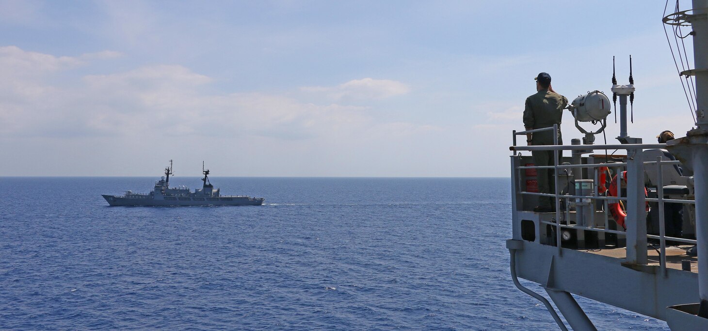 CHINA SEA (March 19, 2019) -  Capt. Eric Anduze, commanding officer of U.S. 7th Fleet Flagship USS Blue Ridge (LCC 19), renders passing honors to Philippine Navy (PN) vessel BRP Ramon Alcaraz (FF 16) during a maritime cooperative activity. Blue Ridge is the oldest operational ship in the Navy and, as 7th Fleet command ship, actively works to foster relationships with allies and partners in the Indo-Pacific Region.