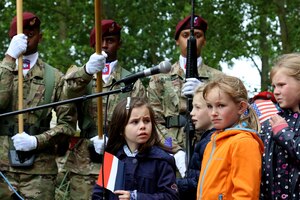 Members of the 82nd Airborne Division and French schoolchildren