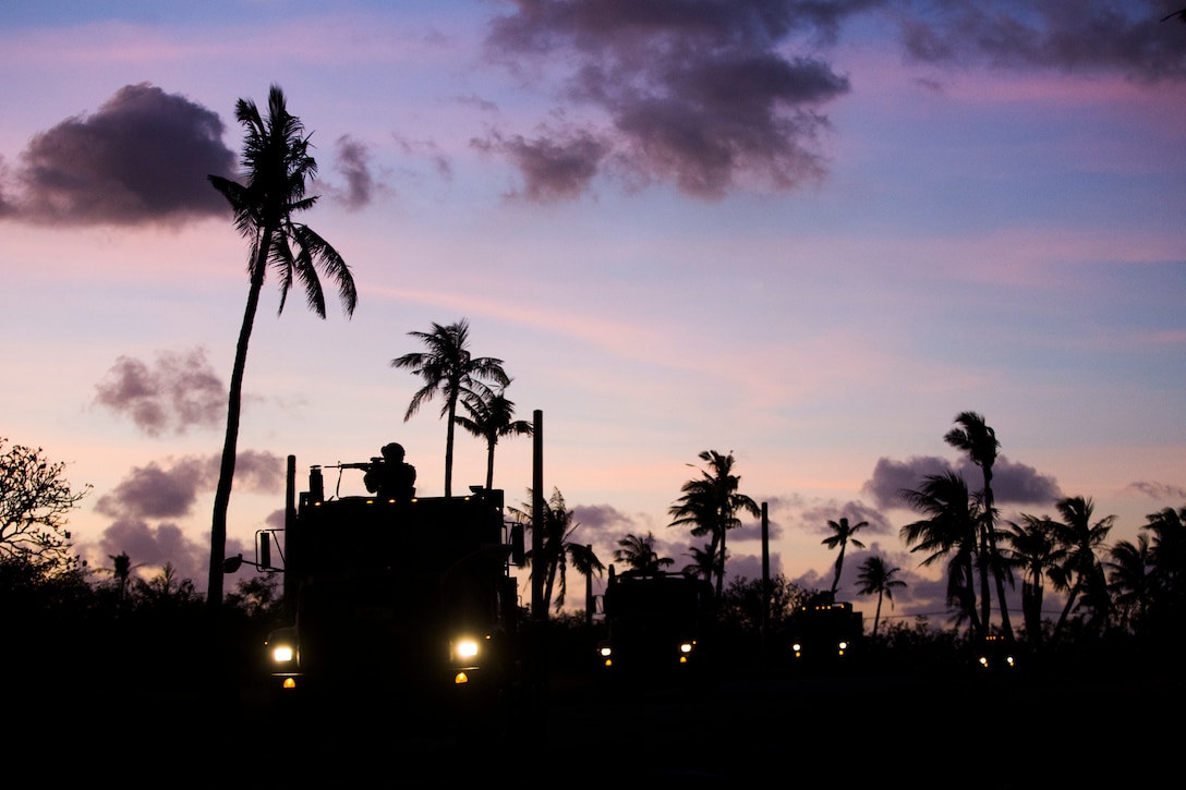 Cpl. Angel Gonzales, a combat engineer with Combat Logistics Battalion 31, provides security atop a 7-ton truck during vehicle convoy training, Naval Base Guam, March 9, 2019. Gonzales, a native of Calexico, California, graduated from Calexico High School in June 2015 before enlisting in August the same year. The Marines and Sailors of CLB-31 offloaded in Guam March 6 to conduct roughly two weeks of planned unit-level training. CLB-31 provides security, logistics, and transportation as the Logistics Combat Element for the 31st Marine Expeditionary Unit. The 31st MEU, the Marine Corps’ only continuously forward-deployed MEU partnering with the Wasp Amphibious Ready Group, provides a flexible and lethal force ready to perform a wide range of military operations as the premier crisis response force in the Indo-Pacific region.