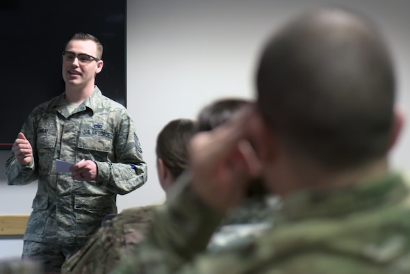 U.S. Air Force Tech. Sgt. Anthony Sweat, 100th Maintenance Squadron NCO-in-charge of non-destructive inspections, gives a presentation about Operation GRIT at RAF Mildenhall, England, March 14, 2019. Operation GRIT is a U.S. Air Forces and Europe-Air Forces Africa program that began in Fall 2018. (U.S. Air Force photo by Senior Airman Benjamin Cooper)