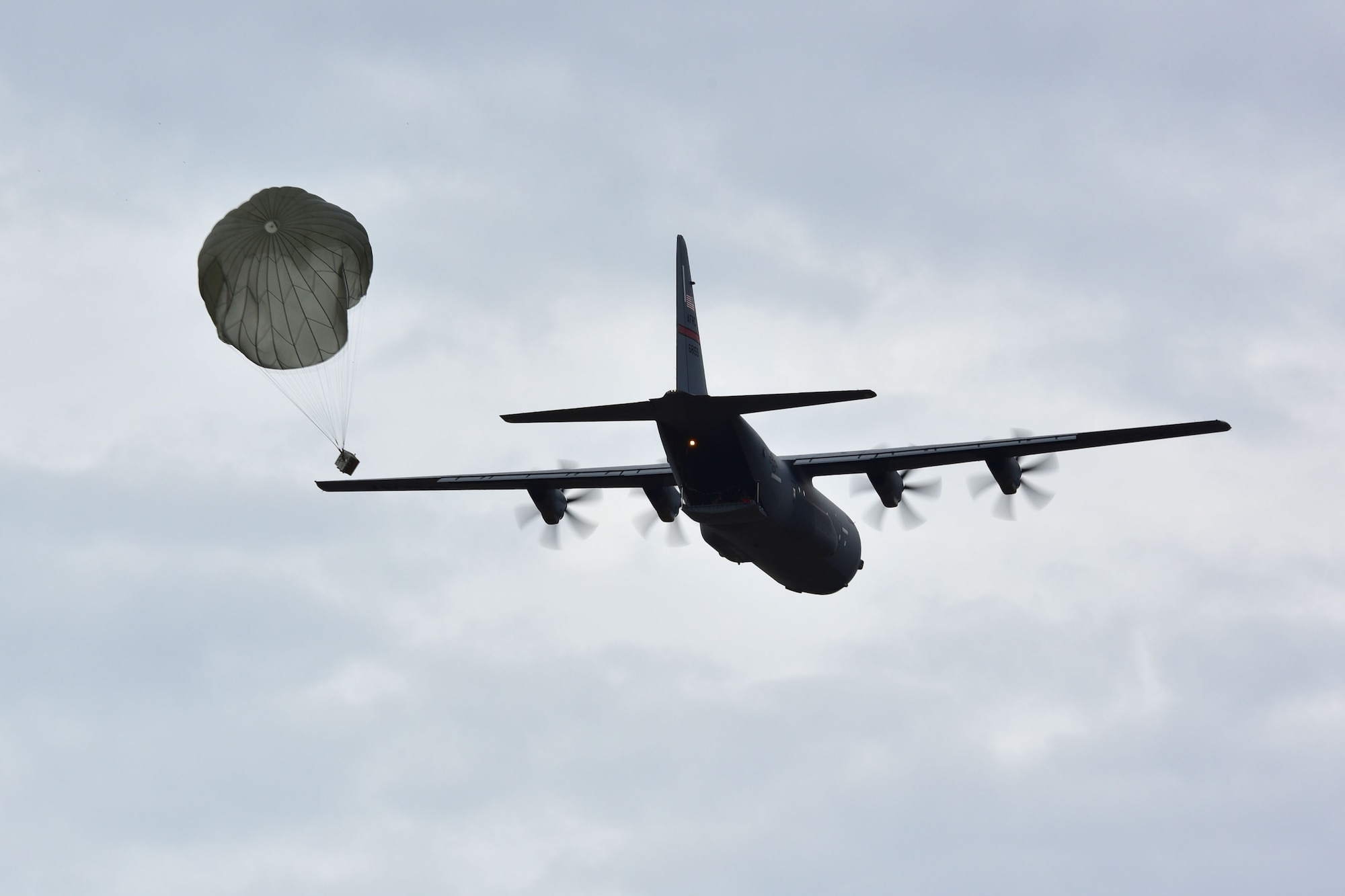 A C-130J does an airdrop.
