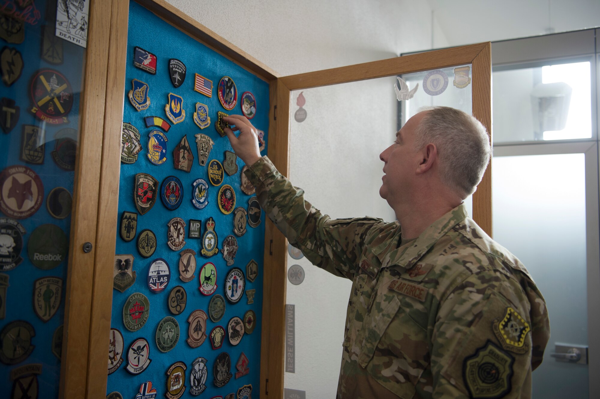 These patches are added to the wall by all the squadrons that visit the 726th AMS PAX terminal