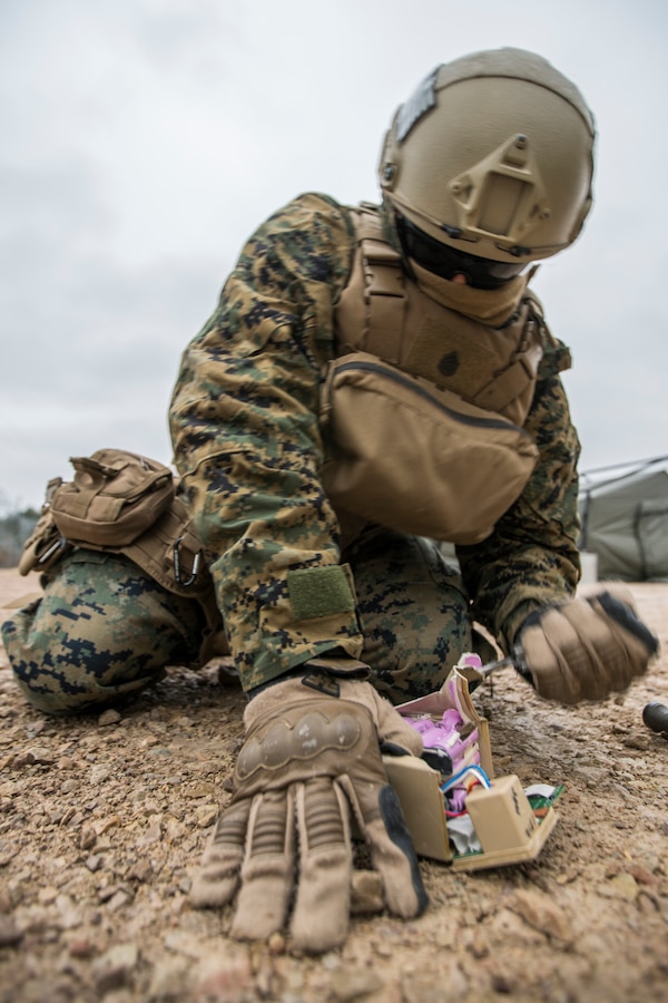 U.S. Marine Corps Staff Sgt. Joseph Martinez, an explosive ordnance disposal Marine attached to Headquarters Battery, 14th Marine Regiment, 4th Marine Division, creates a simulated improvised explosive device at Adazi Training Area, to be used during exercise Dynamic Front 19, March 3, 2019. Exercise Dynamic Front 19 includes approximately 3,200 service members from 27 nations who are observing or participating from Grafenwoehr Training Area, Germany; Riga, Latvia; and Torun, Poland; during March 2-9, 2019. Dynamic Front is an annual U.S. Army Europe exercise focused on the readiness and interoperability of U.S. Army, joint service, and allied and partner nations’ artillery and fire support working together in a multinational environment. (U.S. Marine Corps photo by Cpl. Niles Lee)