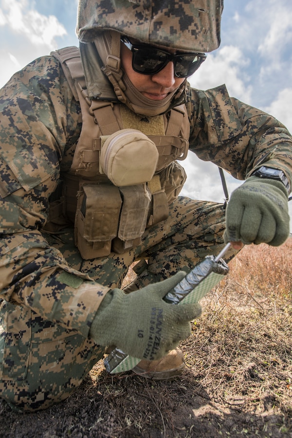 A U.S. Marine with Headquarters Battery, 14th Marine Regiment, 4th Marine Division, inserts electric blasting caps into a block of C4 at a demo range at Adazi Training Area, Latvia, March 8, 2019, during exercise Dynamic Front 19. Exercise Dynamic Front 19 includes approximately 3,200 service members from 27 nations who are observing or participating from Grafenwoehr Training Area, Germany; Riga, Latvia; and Torun, Poland; during March 2-9, 2019. Dynamic Front is an annual U.S. Army Europe exercise focused on the readiness and interoperability of U.S. Army, joint service, and allied and partner nations’ artillery and fire support working together in a multinational environment. (U.S. Marine Corps photo by Cpl. Niles Lee)