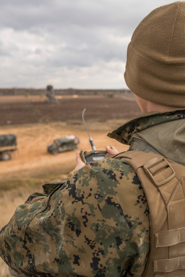 A U.S. Marine with Headquarters Battery, 14th Marine Regiment, 4th Marine Division, watches a C4 detonation at a demo range at Adazi Training Area, Latvia, March 8, 2019, during exercise Dynamic Front 19. Exercise Dynamic Front 19 includes approximately 3,200 service members from 27 nations who are observing or participating from Grafenwoehr Training Area, Germany; Riga, Latvia; and Torun, Poland; during March 2-9, 2019. Dynamic Front is an annual U.S. Army Europe exercise focused on the readiness and interoperability of U.S. Army, joint service, and allied and partner nations’ artillery and fire support working together in a multinational environment. (U.S. Marine Corps photo by Cpl. Niles Lee)