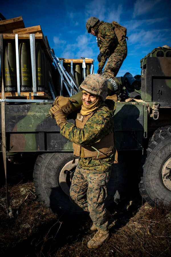 A U.S. Marine with Hotel Battery, 3rd Battalion, 14th Marine Regiment, 4th Marine Division, carries a M795 155mm projectile at Adazi Training Area, Latvia, March 2, 2019, in support of exercise Dynamic Front 19. DF19 will provide an intense, realistic environment that takes advantage of U.S. Army Europe’s unique training resources to seamlessly coordinate fires in support of U.S. and Allied operations. Approximately 3,200 participants from 27 nations will take part in the live-fire portion of exercise Dynamic Front 19, March 2-9, 2019, at the U.S. Army's Grafenwoehr Training Area, Germany; as well as in Riga, Latvia; and Torun, Poland. (U.S. Marine Corps photo by Sgt. Andy O. Martinez)