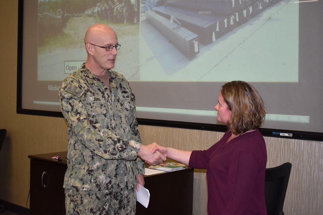 Distribution’s Pulgar presented commander’s coin