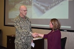 Distribution’s Pulgar presented commander’s coin