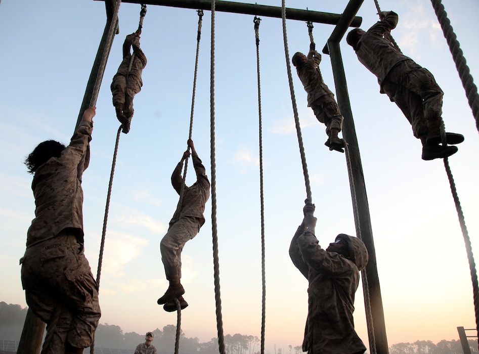 Recruits with November Company, 4th Recruit Training Battalion, complete obstacles during the Crucible at Marine Corps Recruit Depot Parris Island, Feb, 21. The Crucible is a 54-hour culminating event that requires recruits to work as a team and overcome challenges in order to earn the title United States Marine. (U.S. Marine Corps photo by Warrant Officer Bobby J. Yarbrough/Released)