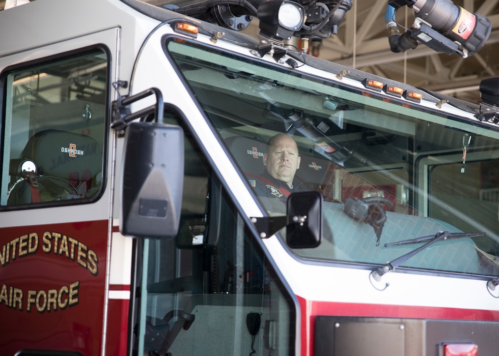 Firefighter Russell Pressley, a driver/operator with the Roland R. Wright Fire Department stands operates an Oshkosk “Striker” Fire Fighting truck March 11, 2019 at Roland R. Wright Air National Guard Base, Salt Lake City, Utah. Pressley responded to a tanker truck fire in Salt Lake City on February 22, 2019 and was able to assist local fire fighters with the specialized truck.