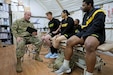 Cpt. Anthony Williams, physical therapist for 3rd Armored Brigade Combat Team, 4th Infantry Division, shows Soldiers video of their running gait in order to correct deficiencies and prevent injury, as part of a weekly running class at Camp Buehring, Kuwait. Williams evaluated the running form of each Soldier and provided feedback for how to improve form and mechanics.
