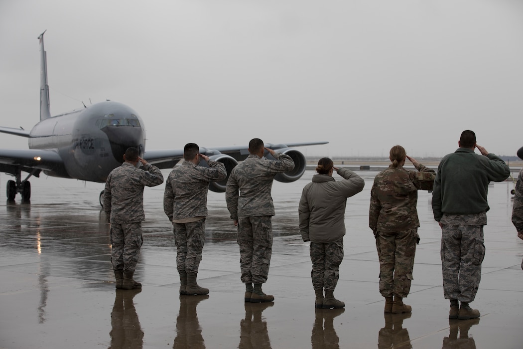 Members of the 151st Operations Group salute as Joint Force Headquarters Assistant Director of Operations, Utah Air National Guard Col. Ryan Ogan taxis in from his "fini" flight aboard a KC-135R at Roland R. Wright Air National Guard Base, Salt Lake City, Utah, January 17, 2019. The "fini" flight is a time-honored military tradition marking the last flight of an aircrew member’s time with a unit or retirement. Prior to being assistant director of operations, Ogan served as the 151st Air Refueling Wing commander.