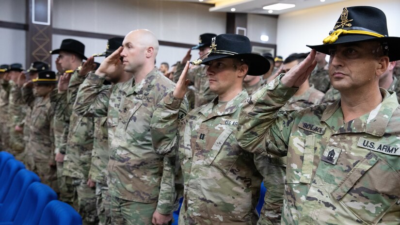 U.S. Army Soldiers salute for the playing of the National Anthem during a transfer of authority ceremony at the Joint Training Center, March 14, 2019. During the ceremony, the New Jersey National Guard’s 1st Squadron, 102nd Cavalry Regiment assumed mission authority from the California National Guard’s 1st Squadron, 18th Cavalry Regiment.