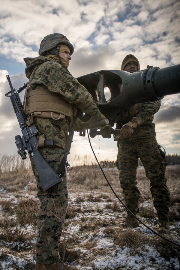 U.S. Marines with Hotel Battery, 3rd Battalion, 14th Marine Regiment, 4th Marine Division, maneuver a M777 howitzer into position before a live-fire range at Adazi Training Area, Latvia, March 1, 2019, during exercise Dynamic Front 19. Approximately 3,200 participants from 27 nations will take part in the live-fire portion of exercise Dynamic Front 19, March 2-9, 2019, at the U.S. Army's Grafenwoehr Training Area, Germany; as well as in Riga, Latvia; and Torun, Poland. (U.S. Marine Corps photo by Cpl. Niles Lee)