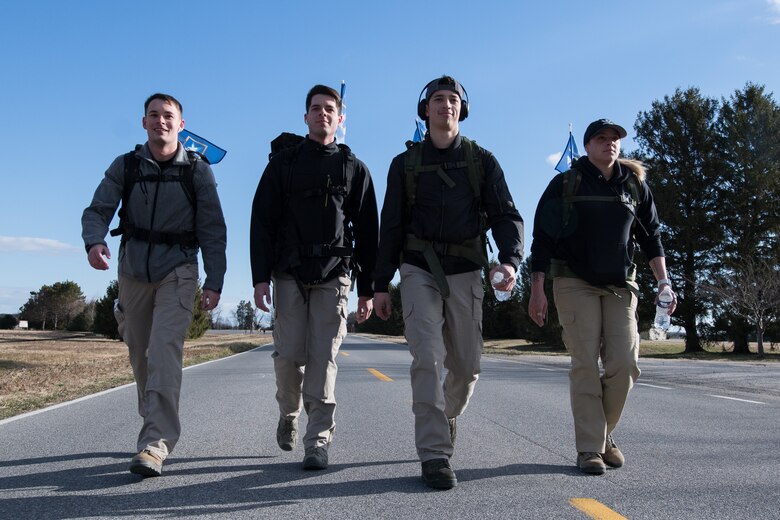A group of Airmen from the 436th Security Forces Squadron walk in the 20th Annual Chosin Ruck March on March 16, 2019, at the Air Mobility Command Museum on Dover Air Force Base, Del. Participants had the option to register as individual runners or in teams of four. (U.S. Air Force Photo by Mauricio Campino)
