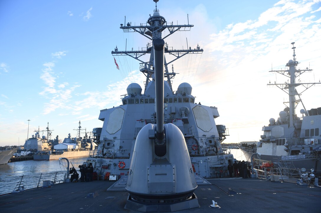 Sailors walk on ship