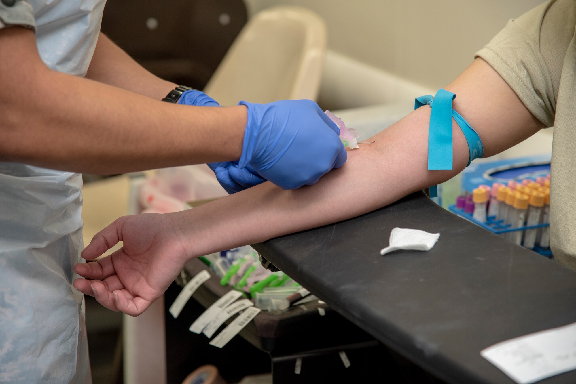 An Air Force Basic Military Trainee at Lackland Air Force Base, Texas, gets blood drawn for lab tests and DNA cards November 8, 2018. In 1992, the Armed Forces Medical Examiner System-The Armed Forces Repository of Specimen Samples was established to aid in the identification of remains and started with 10,000 collections at Fort Knox, Kentucky. (U.S. Air Force photo/Staff Sgt. Nicole Leidholm)