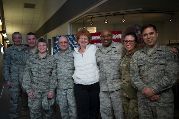The 446th Airlift Wing Airman and Family Readiness team and the 446 AW Command Chief are gathered for a group photo.