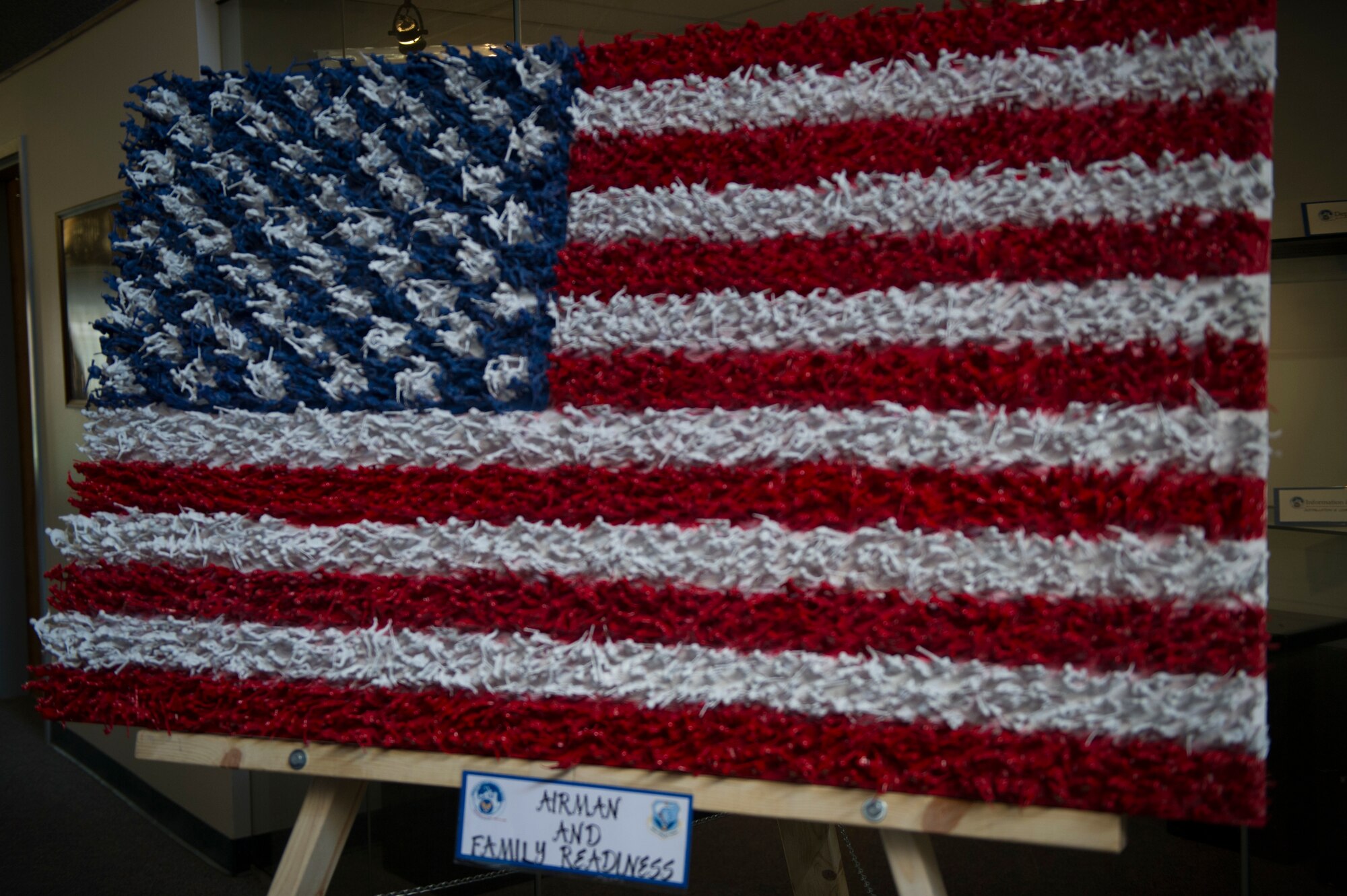 The piece is made up of painted toy soldiers. Members of the Airman and Family Readiness office worked on the piece.