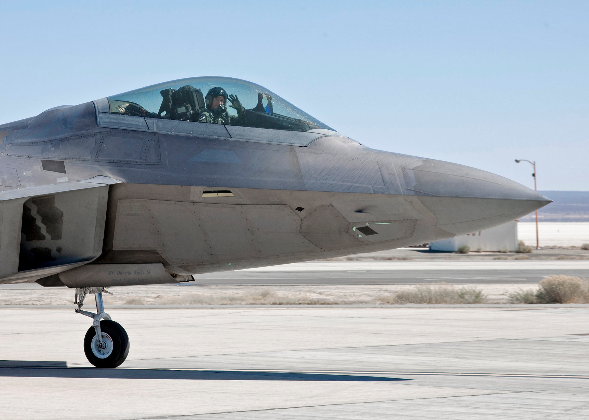 Maj. Gen. Dawn Dunlop, former 412th Test Wing commander, conducted her final flight as wing commander onboard an F-22 Raptor at Edwards Air Force Base, California, March 12, 2012. Dunlop served as the vice commander and then eventually commander from August 2009, to March 2012. (U.S. Air Force photo by David Henry)