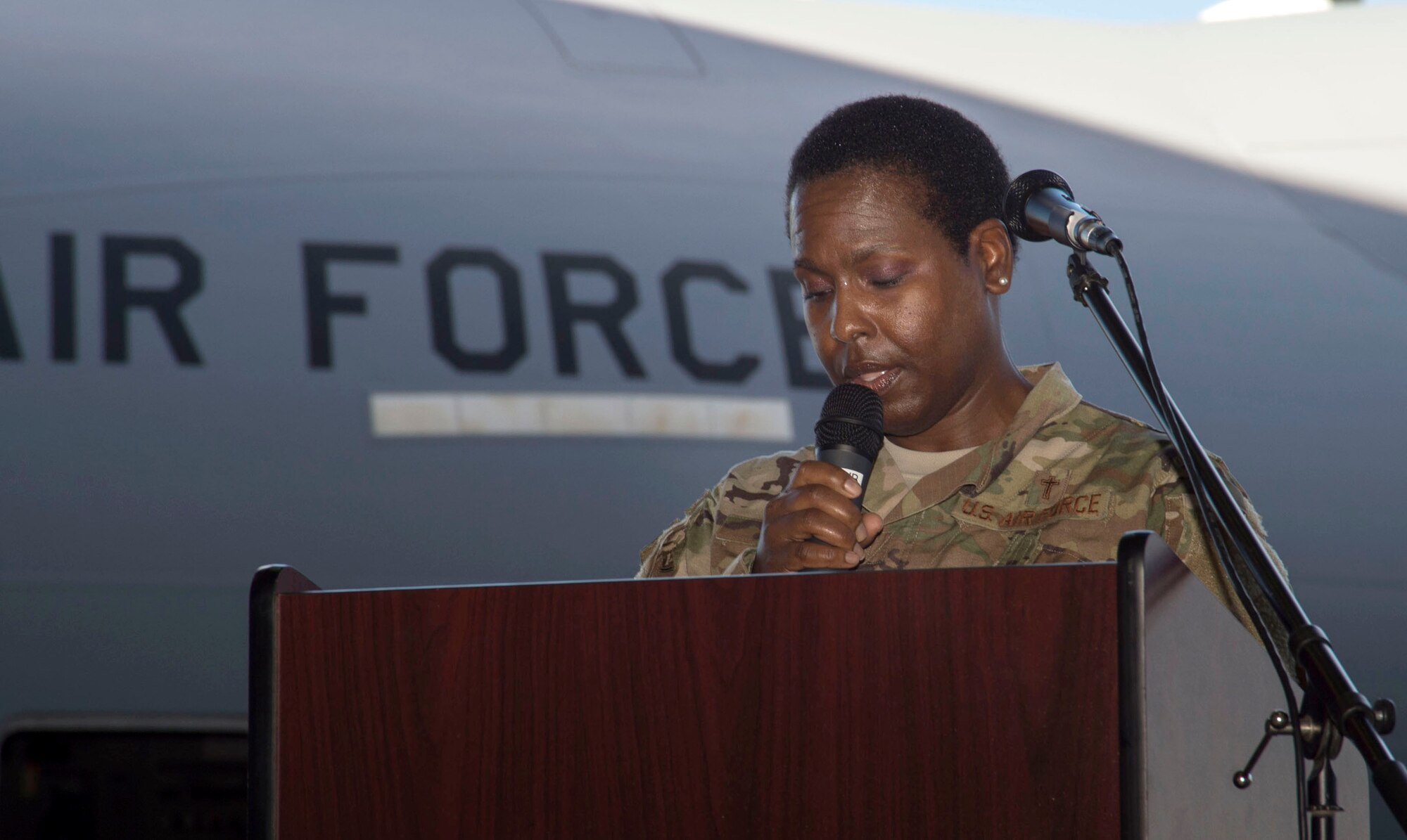 Capt. Tamara Rowe, 647th Air Base Group chaplain, leads a prayer during an aircraft plaque ceremony on Harbor-Hickam, Hawaii, March 19, 2019. The 647th ABG Chaplain Corps, provides a wide range of services that includes worship, religious education, confidential counseling, unit engagement, and many other programs. (U.S. Air Force photo by Tech. Sgt. Heather Redman)