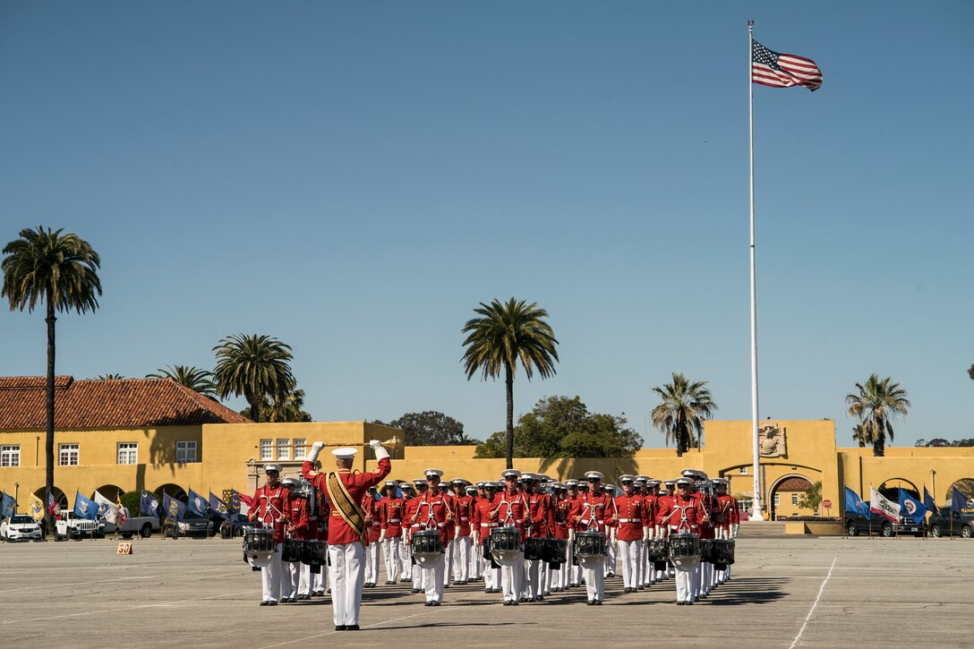 The U.S. Marine Corps Drum & Bugle Corps assembles on the Marine Corps Recruit Depot San Diego Parade Deck during the Battle Color Ceremony March 16. The Battle Color Detachment consists of the Drum & Bugle Corps, the Silent Drill Platoon, and the Marine Corps Color Guard who travel and perform throughout the nation, celebrating Marine Corps history. (U.S. Marine Corps photo by Sgt. Christian Cachola)