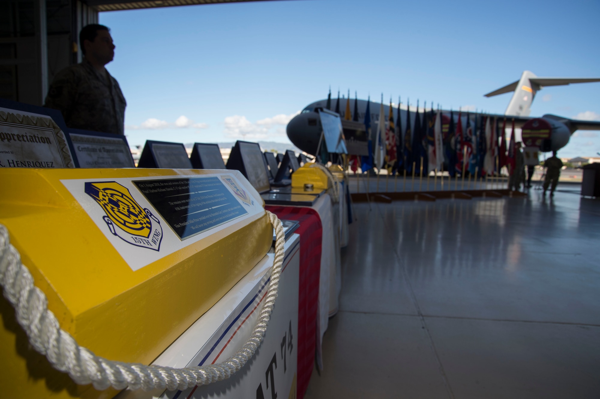 Two parking chocks sit on display during the North Korea Aircraft Commemorative Plaque Ceremony on Joint Base Pearl Harbor-Hickam, Hawaii, March 12, 2019. In 2018, two C-17 Globemaster IIIs, tail numbers 05-5147 and 05-5148, carried the remains of 55 American soldiers killed in the Korean War. During the ceremony, plaques were unveiled to identify the aircraft and its aircrew who participated in bringing home the fallen service members. (U.S. Air Force photo by Tech. Sgt. Heather Redman)