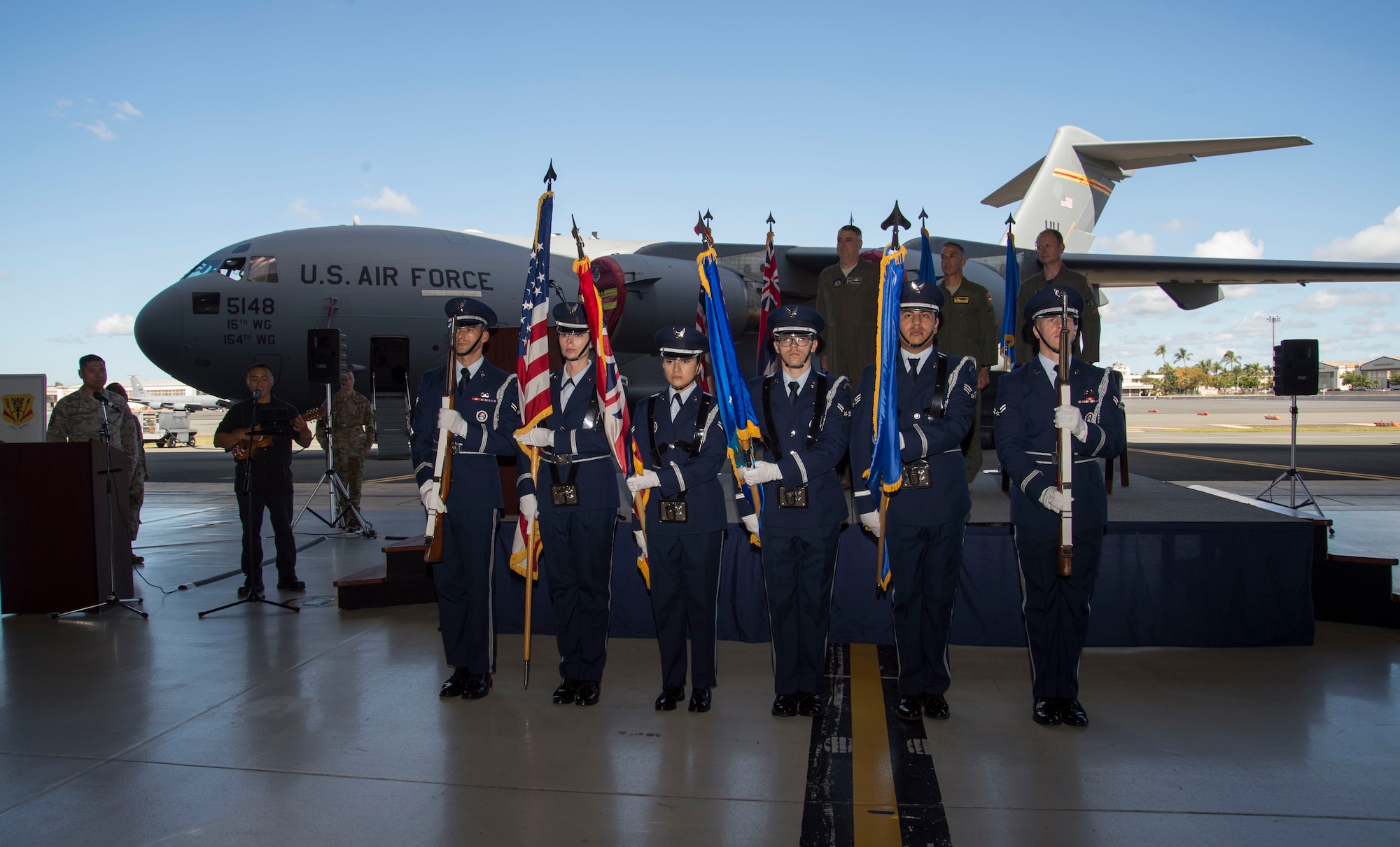 The Hickam Honor Guard presents the colors during the North Korea Aircraft Commemorative Plaque Ceremony on Joint Base Pearl Harbor-Hickam, Hawaii, March 12, 2019. The ceremony recognized two C-17 Globemaster IIIs, tail numbers 05-5147 and 05-5148, and their crewmembers who participated in bringing home 55 service members killed in the Korean War. (U.S. Air Force photo by Tech. Sgt. Heather Redman)