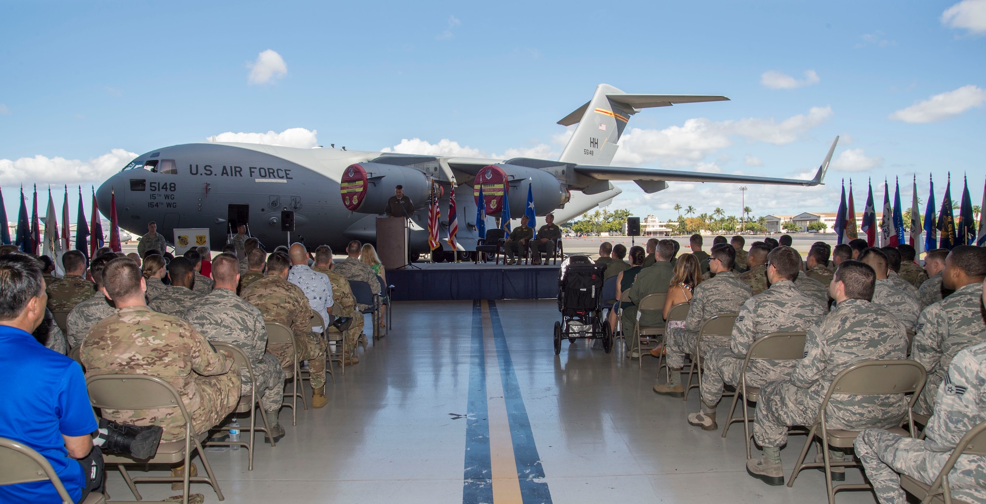 Audience members listen to Maj. Gen. Michael A. Minihan, U.S. Indo-Pacific Command chief of staff, during the North Korea Aircraft Commemorative Plaque Ceremony on Joint Base Pearl Harbor-Hickam, Hawaii, March 12, 2019.  In 2018 two C-17 Globemaster IIIs, tail numbers 05-5147 and 05-5148, carried the remains of 55 American soldiers killed in the Korean War. Currently, there are about 7,700 U.S. soldiers listed as missing from the Korean War and about 5,300 of the remains are believed to still be in North Korea. (U.S. Air Force photo by Tech. Sgt. Heather Redman)
