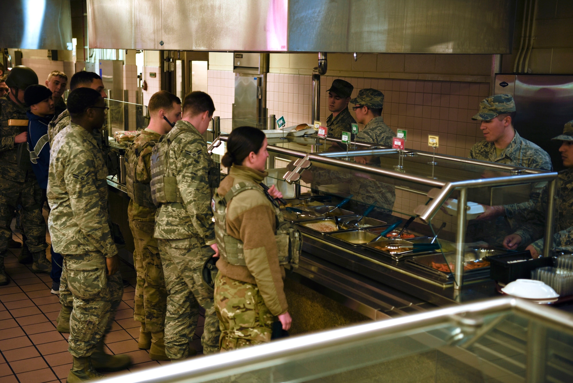 8th Force Support Squadron Airmen serve a contingency meal as part of their training to 8th Fighter Wing personnel at Kunsan Air Base, Republic of Korea, March 14, 2019. 8th FSS Airmen trained on the planning, preparing and serving of a hot meal during a contingency event. (U.S. Air Force photo by Tech. Sgt. Charles McNamara)