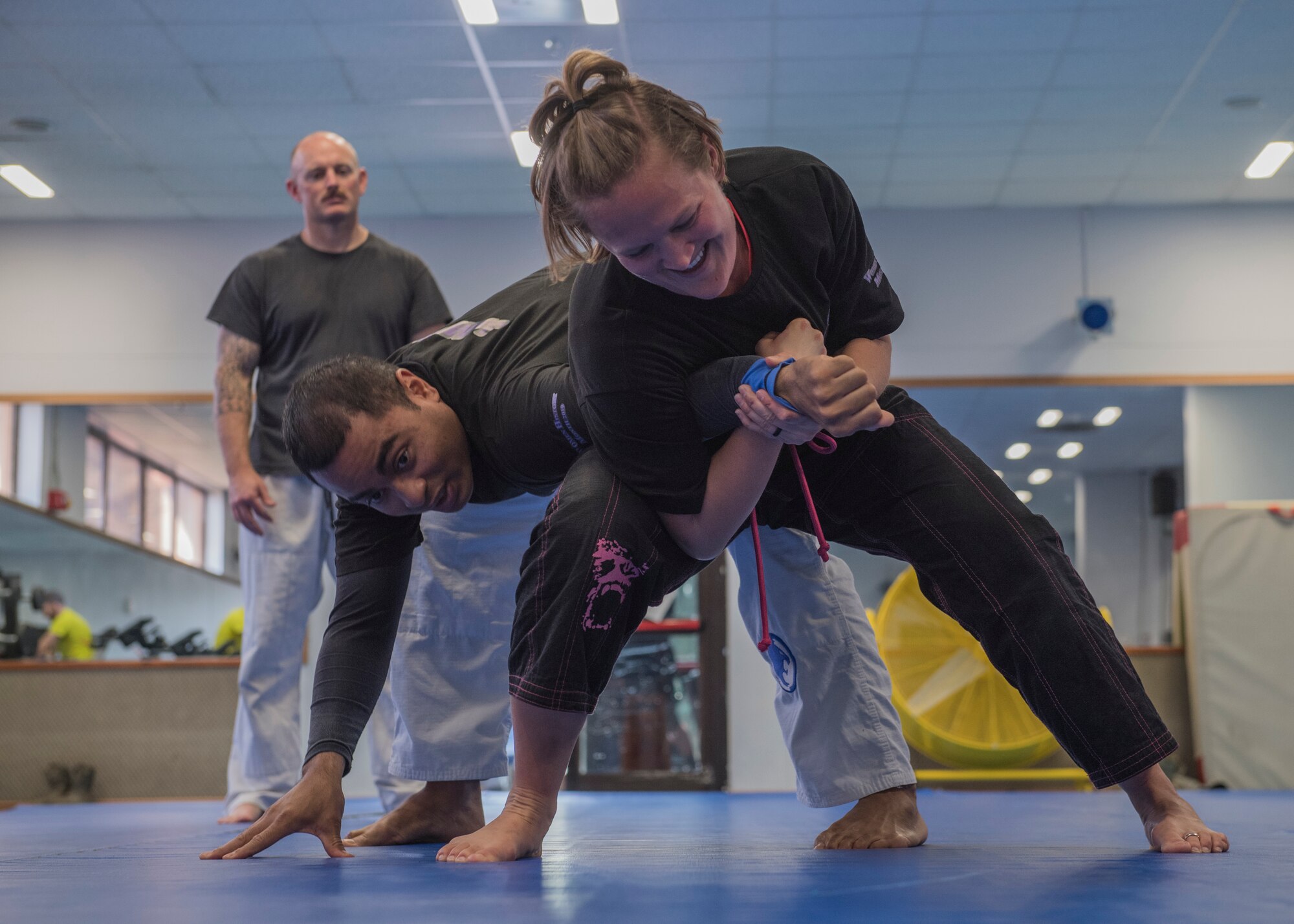 Maj. Lydia Rodriguez, 39th Medical Operations Squadron Medical Services Flight commander, demonstrates a hold on Tech. Sgt. James Baldwin, 39th Security Forces Squadron NCO in-charge of standardization and evaluations, during a self-defense class March 19, 2019, at Incirlik Air Base, Turkey.