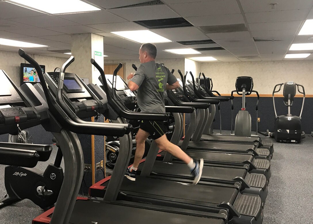 Don Phillips, DLA Installation Support at Battle Creek site director, uses a treadmill in the Federal Center’s Fitness Center to complete his run.