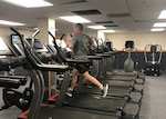 Don Phillips, DLA Installation Support at Battle Creek site director, uses a treadmill in the Federal Center’s Fitness Center to complete his run.