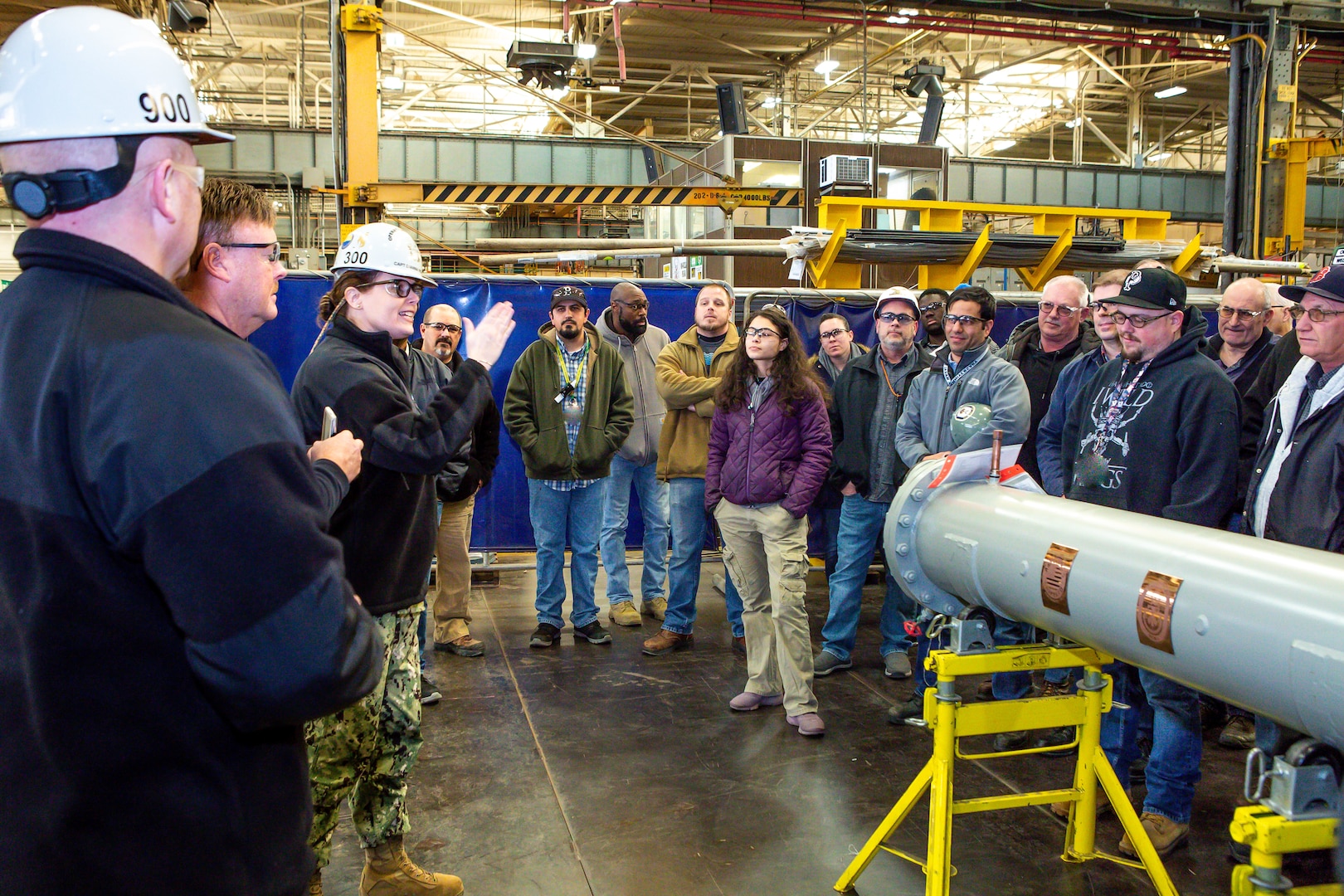 CAPT Dianna Wolfson, Norfolk Naval Shipayrd's former Code 1200 business and strategic planning officer, addresses the minesweeper condenser building team.