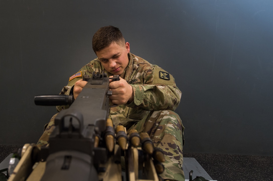 U.S. Army Pvt. Andrew Carlisle, Foxtrot Company, 1st Battalion, 210th Aviation Regiment, 128th Avn. Brigade student, trains at the Engagement Skills Trainer at Joint Base Langley-Eustis, Virginia, March 20, 2019.