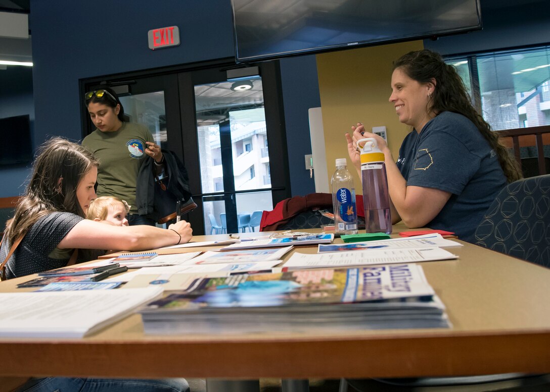 A participant signs in at a deployed spouse’s dinner, March 19, 2019, at Moody Air Force Base, Ga. The mission’s success depends on resilient Airmen and families, who are prepared to make sacrifices with the support of their fellow Airmen, local communities and leadership. (U.S. Air Force photo by Airman 1st Class Eugene Oliver)