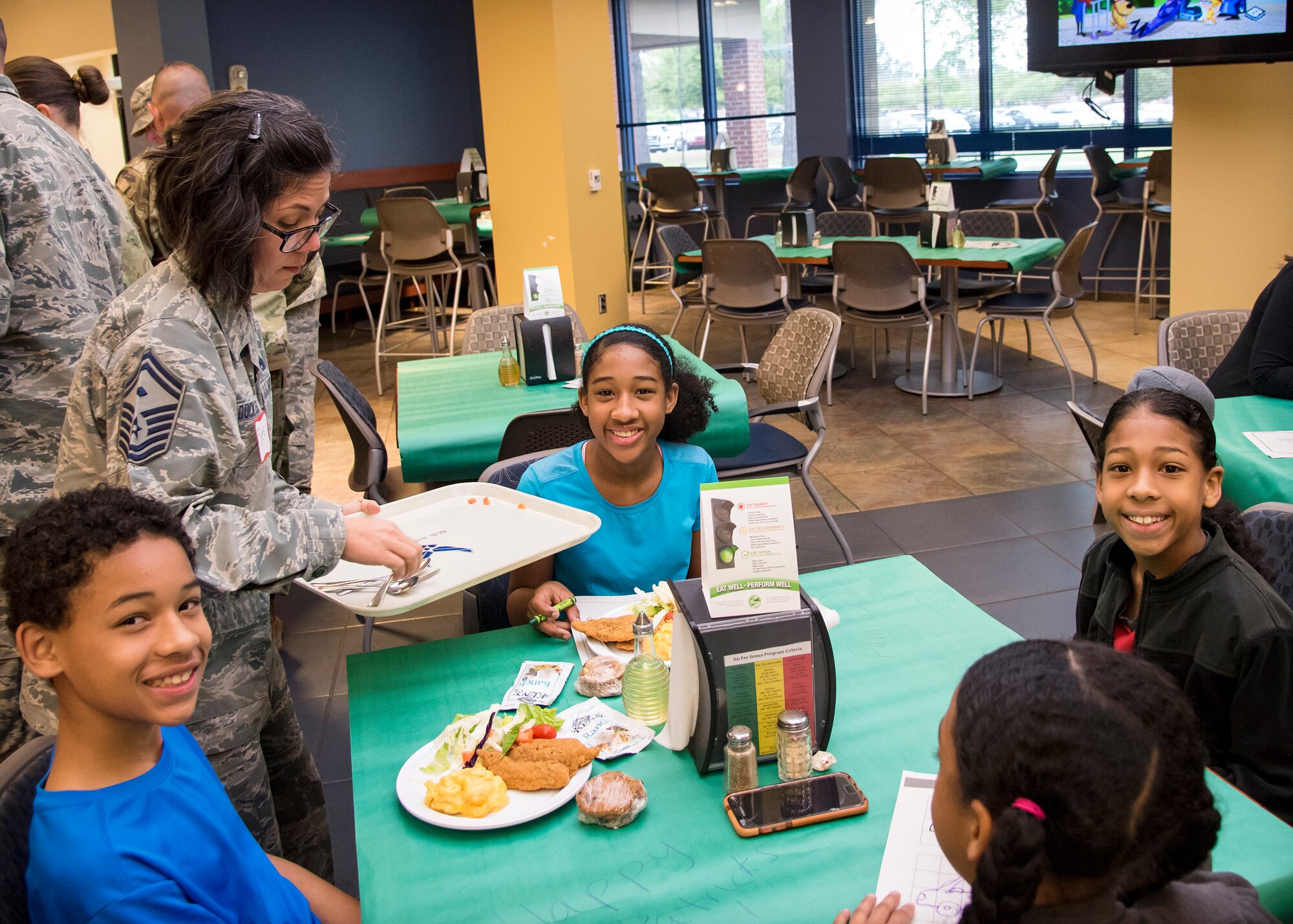 Senior Master Sgt. Regina Dockens, 23d Civil Engineer Squadron first sergeant, serves food to participants during a deployed spouse’s dinner, March 19, 2019, at Moody Air Force Base, Ga. The mission’s success depends on resilient Airmen and families, who are prepared to make sacrifices with the support of their fellow Airmen, local communities and leadership. (U.S. Air Force photo by Airman 1st Class Eugene Oliver)