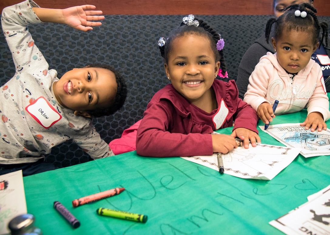 Participants pose for a photo during a deployed spouse’s dinner, March 19, 2019, at Moody Air Force Base, Ga. The mission’s success depends on resilient Airmen and families, who are prepared to make sacrifices with the support of their fellow Airmen, local communities and leadership. (U.S. Air Force photo by Airman 1st Class Eugene Oliver)