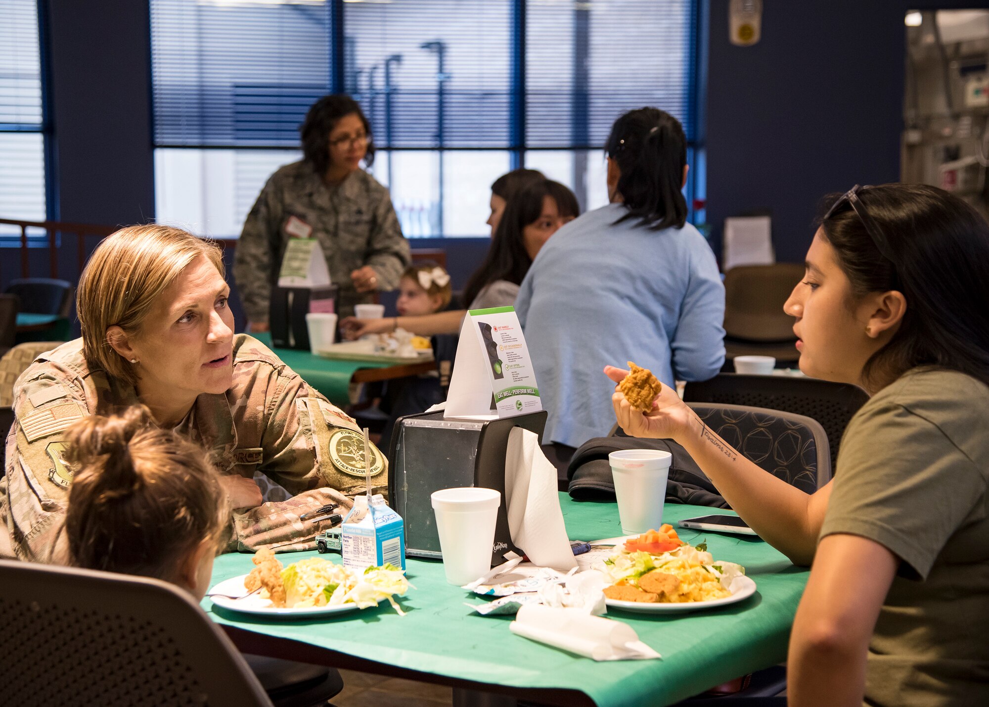 Col. Jennifer Short, 23d Wing commander, speaks with a participant during a deployed spouse dinner, March 19, 2019, at Moody Air Force Base, Ga. The mission’s success depends on resilient Airmen and families, who are prepared to make sacrifices with the support of their fellow Airmen, local communities and leadership. (U.S. Air Force photo by Airman 1st Class Eugene Oliver)