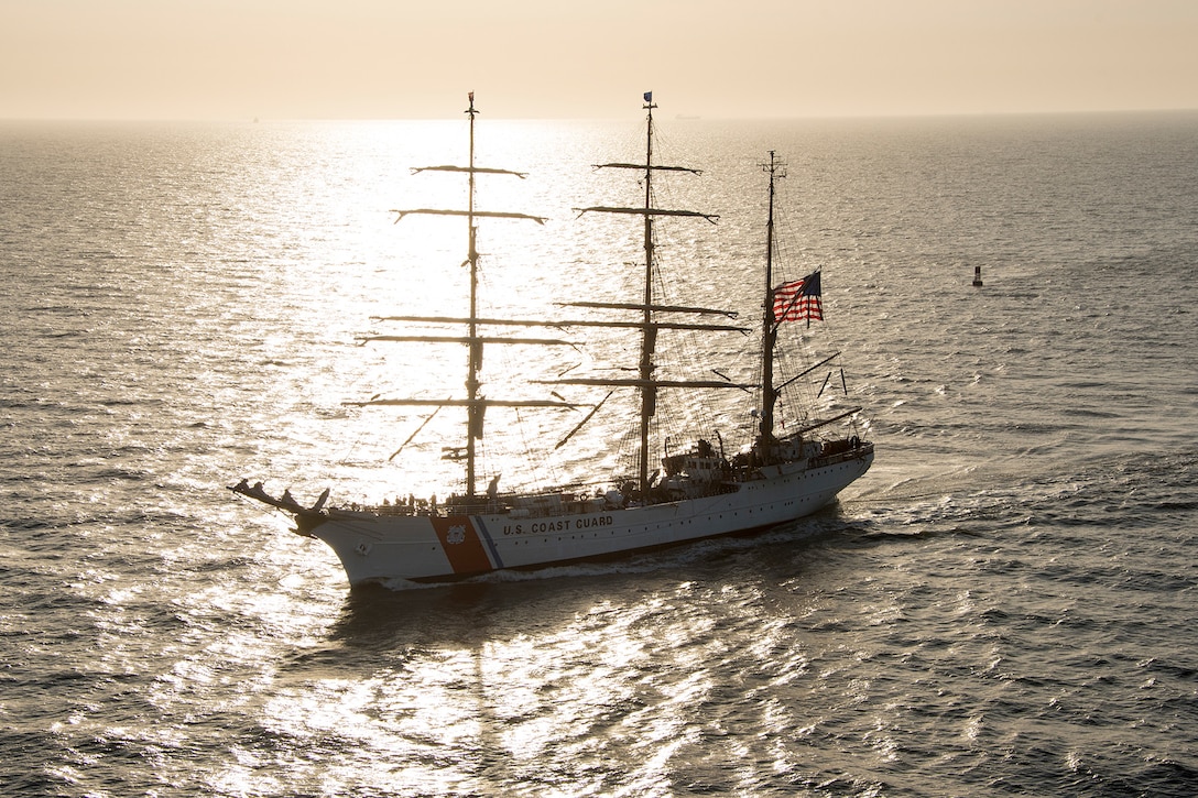 A ship transits a river.