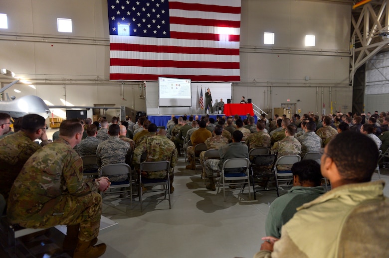 Col. Julian Cheater, 432nd Wing/432nd Air Expeditionary Wing commander, explains plans for future installation development during an all-call at Creech Air Force Base, Nevada, Mar. 8, 2019. This all-call provided 432nd WG leadership with the ability to update Airmen at Creech, as well as the geographically separated units at Ellsworth, Shaw and Whiteman AFBs. (U.S. Air Force photo by Tech. Sgt. Dillon White)
