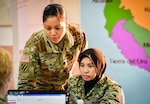 U.S. Army Lt. Col. Angela Gentry, Washington Army National Guard, discusses battle drills with her Malaysian army counterpart, Maj. Nurkhairunisa, during Exercise Bersama Warrior in Malaysia, March 10, 2019.