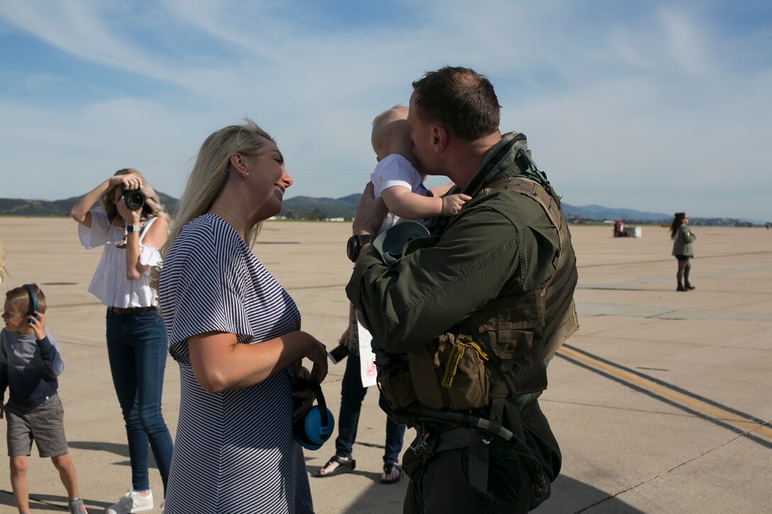 U.S. Marine Corps Maj. John Koepke, an F/A-18 pilot with Marine Fighter Attack Squadron 225, Marine Aircraft Group 11, 3rd Marine Aircraft Wing, reunites with his familybv  at Marine Corps Air Station Miramar, Calif., March 15, following a six-month Unit Deployment Program in Japan. Marines and Sailors flew, fixed, and fought alongside foreign forces throughout Guam, South Korea, and Japan as part of America’s Expeditionary Force in Readiness. (U.S. Marine Corps photo by Lance Cpl. Julian Elliott-Drouin)